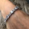 Silver strand Bracelet – adjustable sliding clasp with nine Cubic Zirconia Stones – Nadra